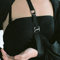 Close up of Werable's black bolero as an arm sling, with G Hook clasp.